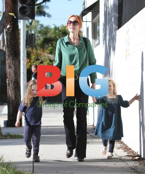 Marcia Cross picks up daughters from school