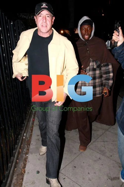 Michael Lohan Gives Cash to Bum