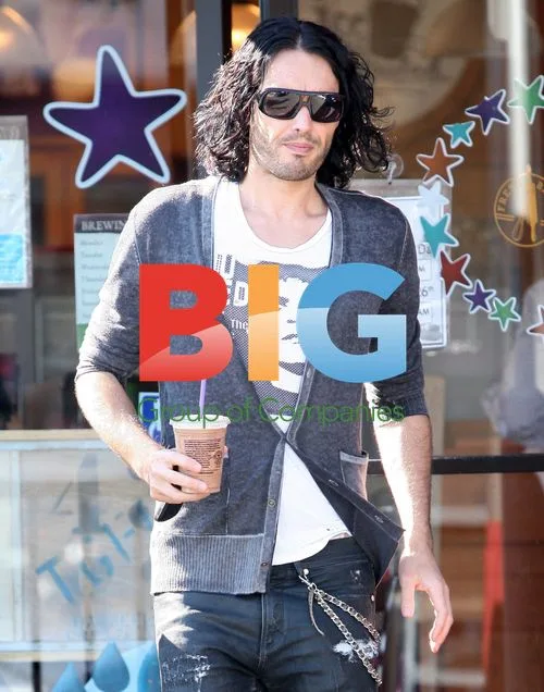 Russell Brand meets friends, takes call