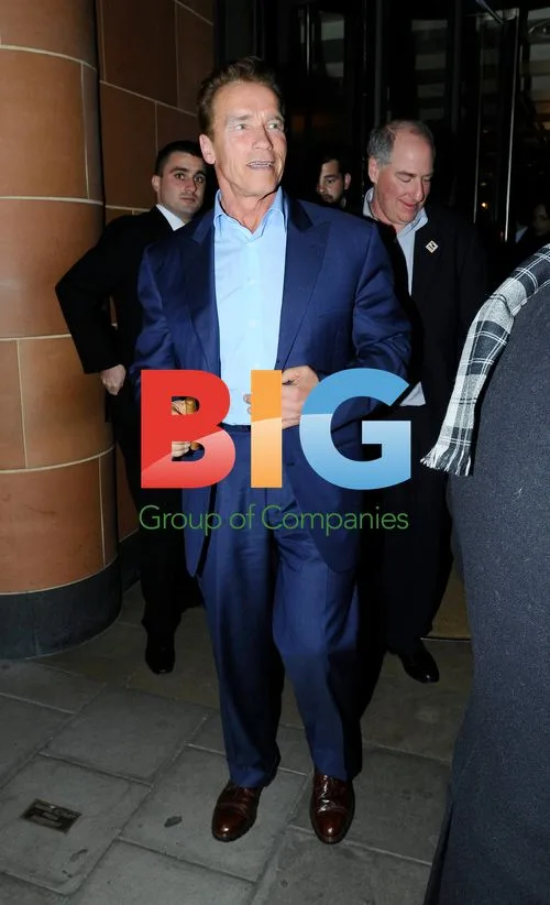 Arnold Schwarzenegger Enjoys Cigar