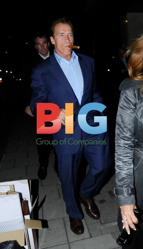 Arnold Schwarzenegger Enjoys Cigar