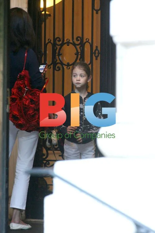 Catherine Zeta-Jones walks daughter and dog to school