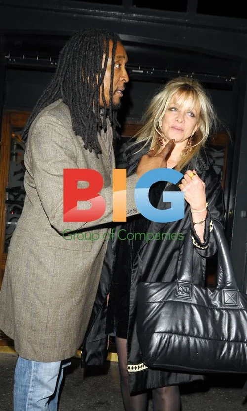 Jo Wood, Tyrone Wood, and mystery man leaving Groucho club