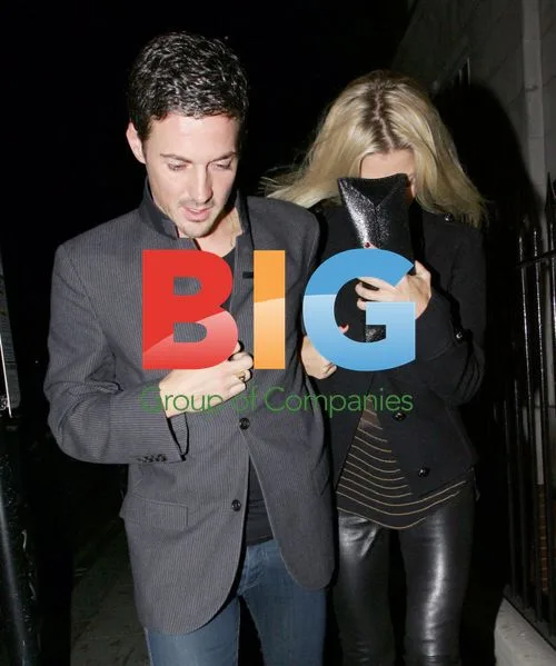 Dave Gardner and girlfriend leaving restaurant