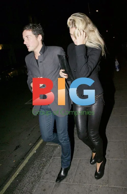 Dave Gardner and girlfriend leaving London restaurant