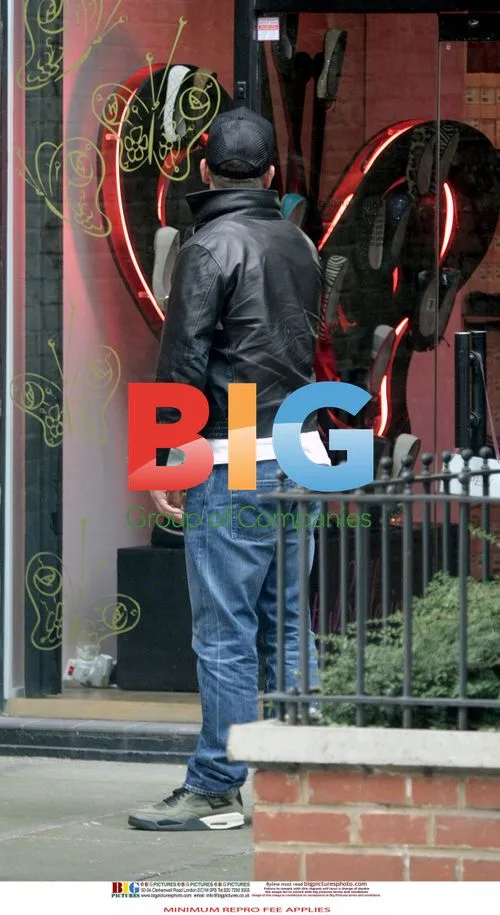 Robbie Williams spotted with mystery woman