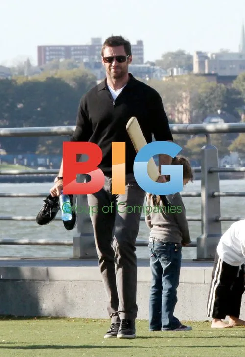 Hugh Jackman with kids at park