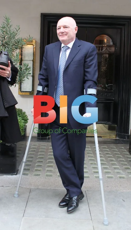 Peter Kenyon on Crutches in London