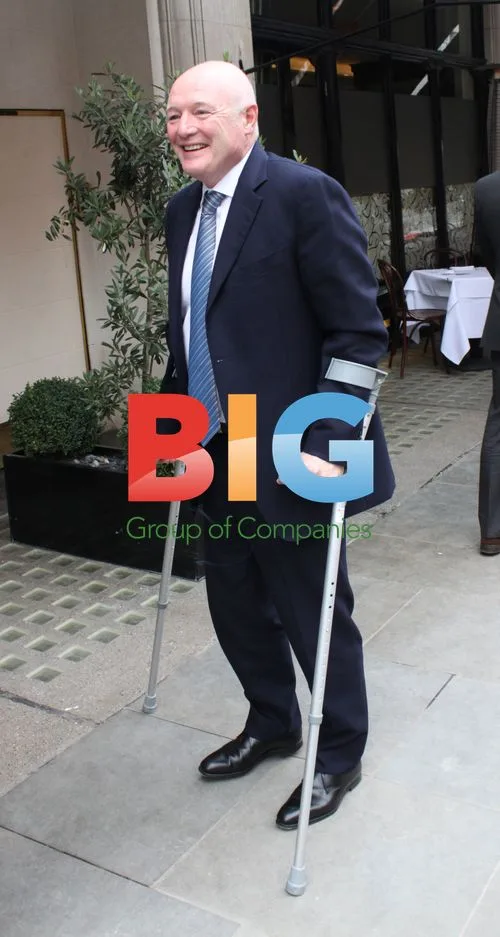 Peter Kenyon on Crutches in London