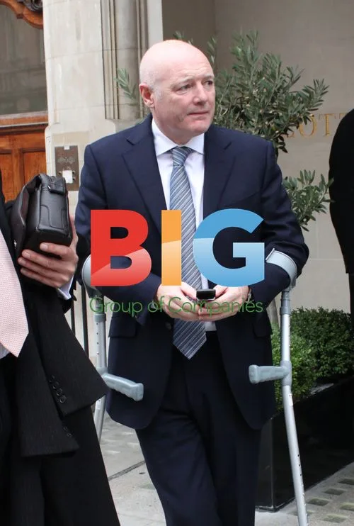 Peter Kenyon on Crutches in London