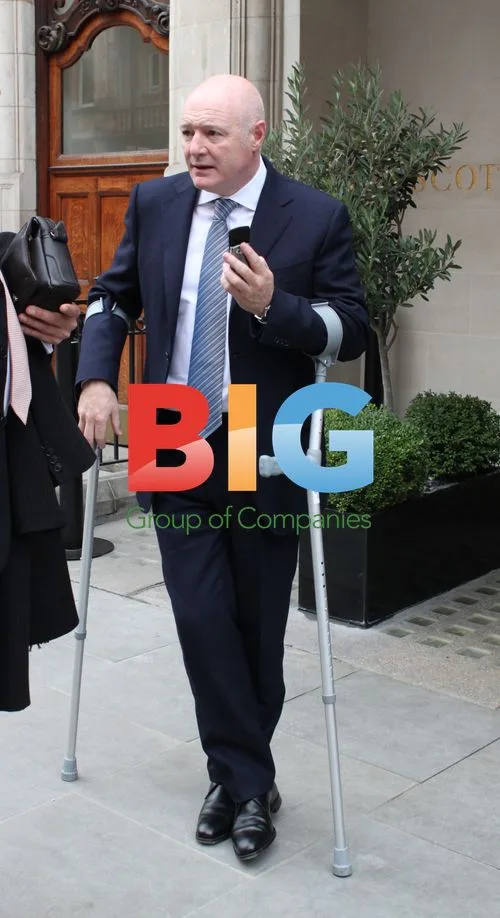 Peter Kenyon on Crutches