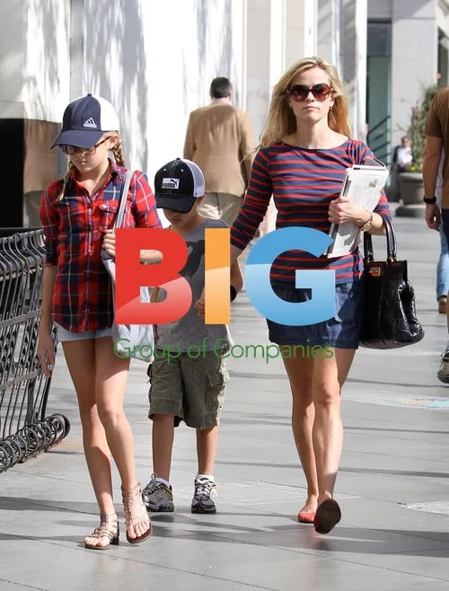 Reese Witherspoon out with kids