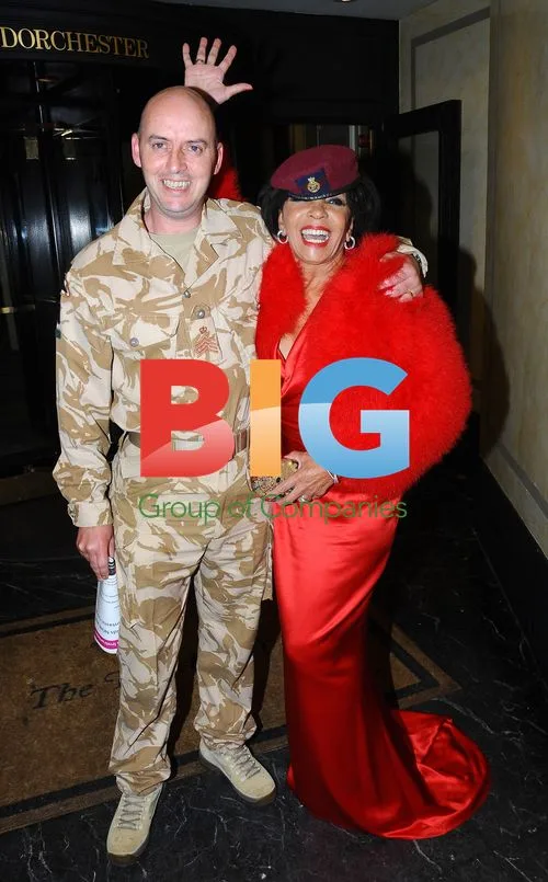 Dame Shirley Bassey and Staff Corporal Julian Hoggarth at Fashion For the Brave