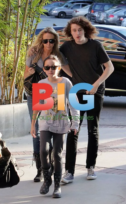 Tish Cyrus and kids at lawyers office