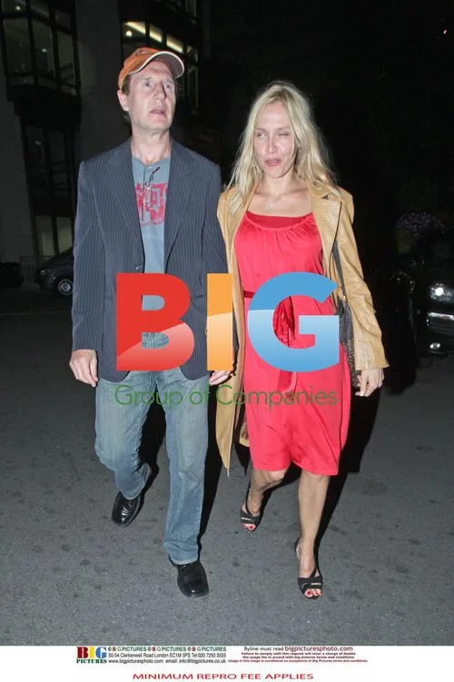 Liam Neeson spotted with blonde woman