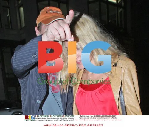 Liam Neeson and Blonde Lady Walk Hand-in-Hand