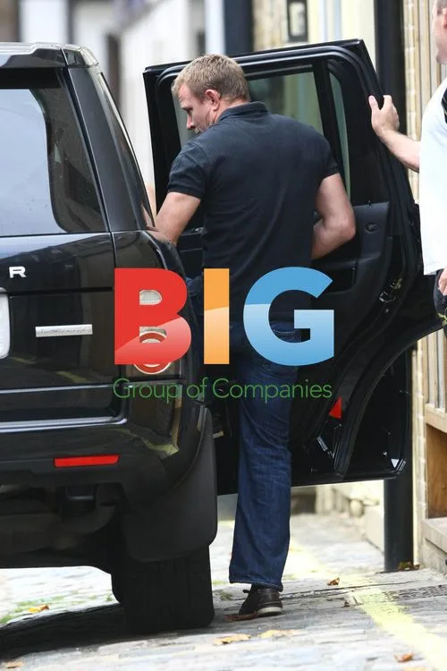 Guy Ritchie Leaves for Meeting in London