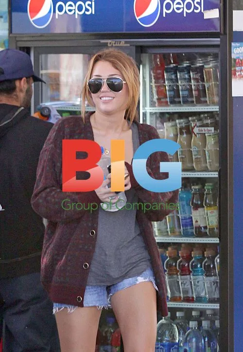 Miley Cyrus Buys Water at Gas Station