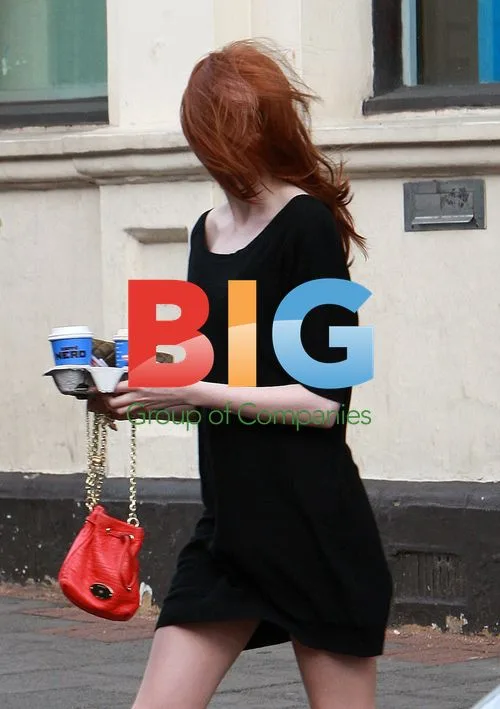 Karen Gillan battles wind in London