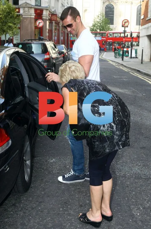 Dannii, Kris and baby Ethan leave hotel