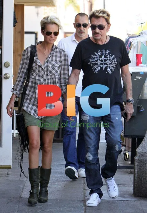 Johnny Hallyday and Laeticia Take Romantic Stroll