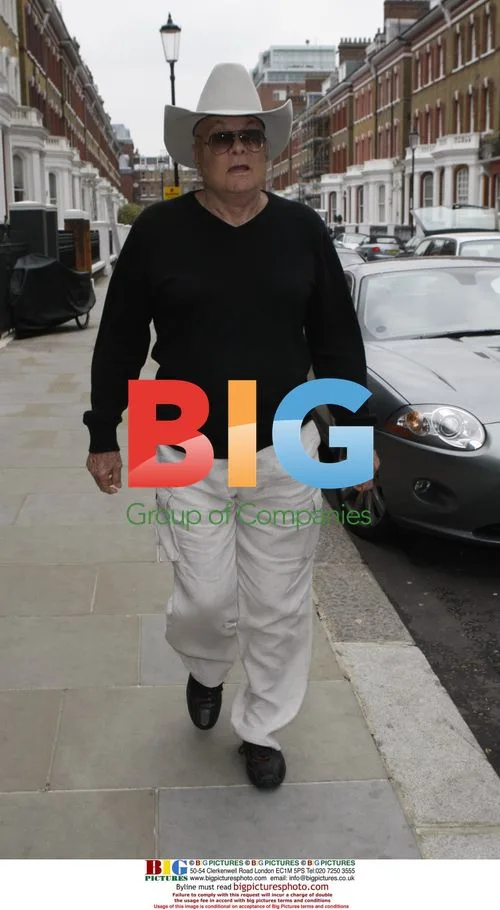 Tony Curtis Leaving Hotel in London
