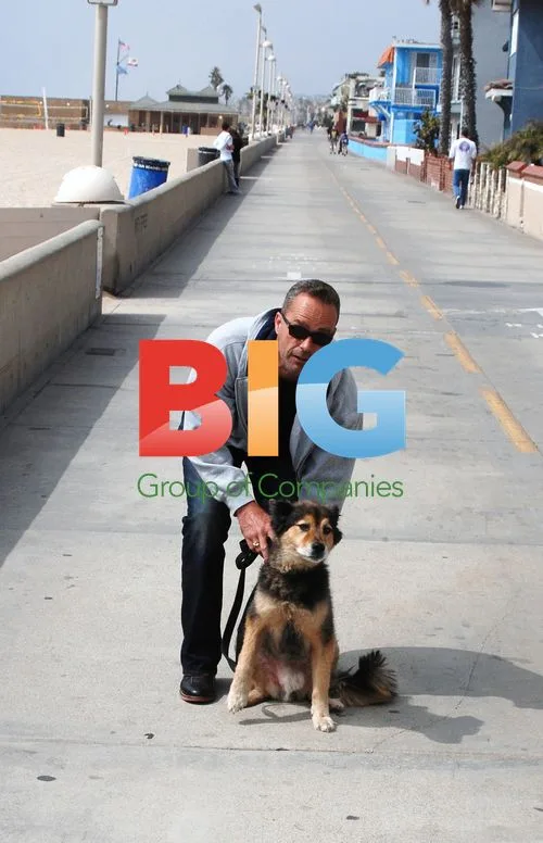 Anthony Vitale walking dog on Hermosa Beach