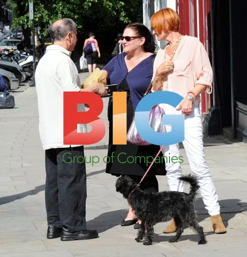 Mary Portas strolls with dog and friend