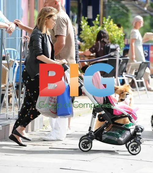 Rachel Stevens and baby in London
