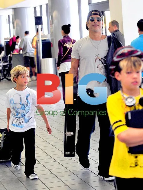 Slash and family arrive at LAX for Mexico trip