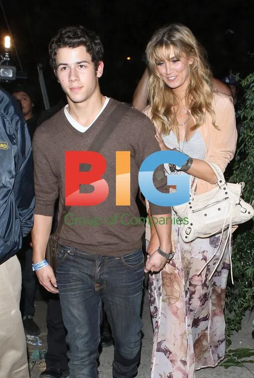 Nick Jonas and Delta Goodrem at Adele concert