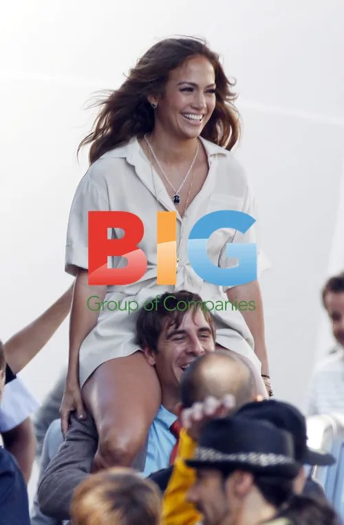 Jennifer Lopez on Crew Member's Shoulders