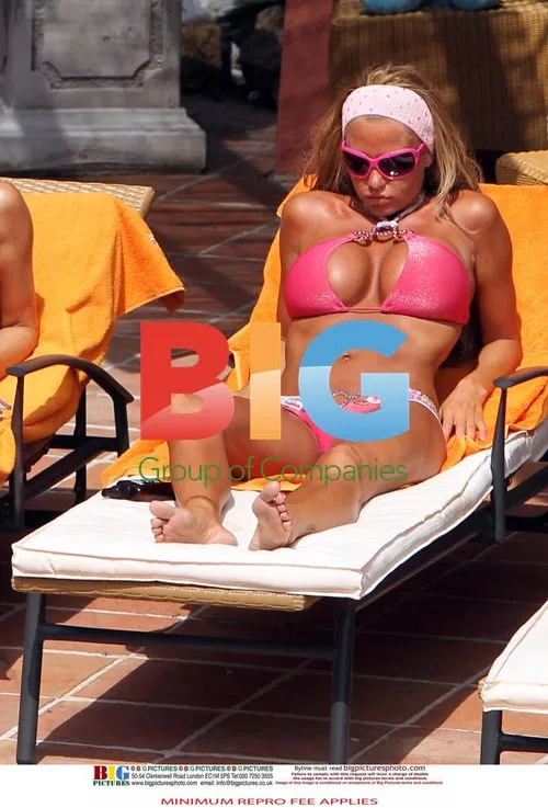 Katie Price Relaxes Poolside in Spain