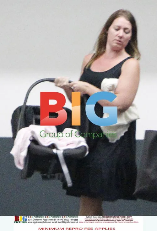 Victoria Beckham Leaves LA Office with Daughter