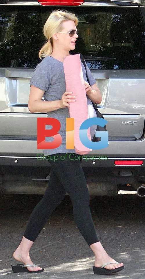 January Jones pregnant, doing yoga