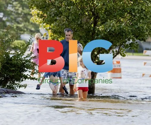 Family wading through flooded Ocean City after Irene