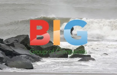 Surfer Walks Beach After Hurricane Irene