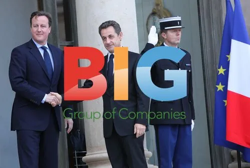 Sarkozy Greets Cameron at Elysee Palace in Paris