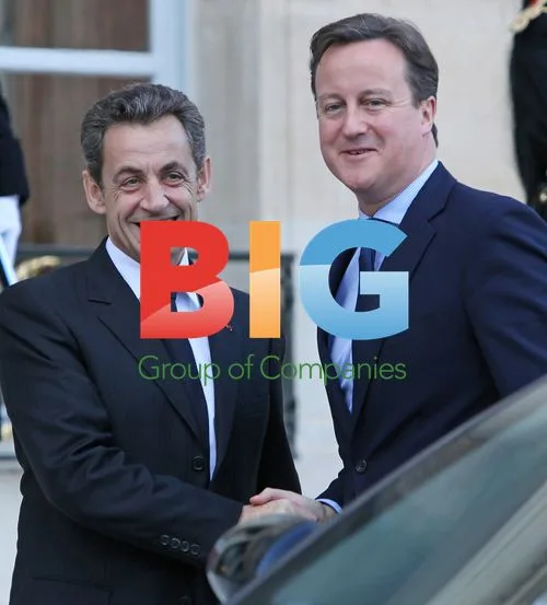 Sarkozy Greets Cameron in Paris
