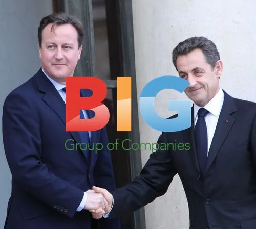 Sarkozy Greets Cameron at Elysee Palace