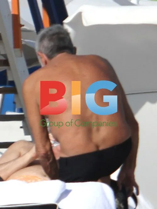 Roberto Cavalli at the Beach with Girlfriend