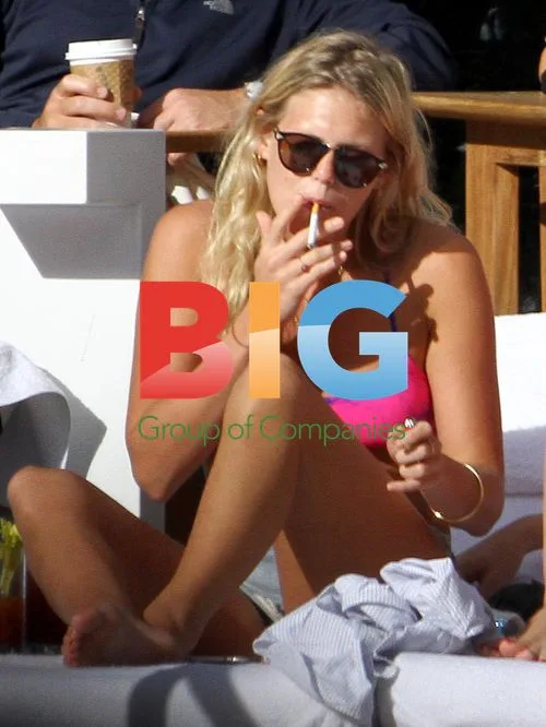 Alexandra Richards Relaxes by Pool in Miami
