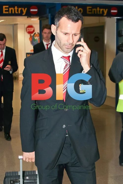 Ryan Giggs Arrives at Manchester Airport