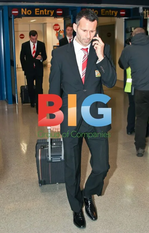 Ryan Giggs Arrives at Manchester Airport