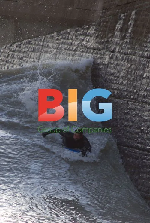 Surfer Rides Wave Near Wall