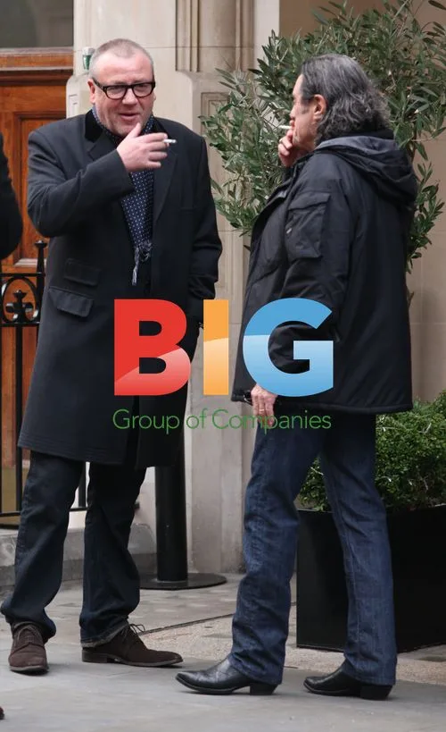 Winstone and McShane Share Laugh on Smoke Break