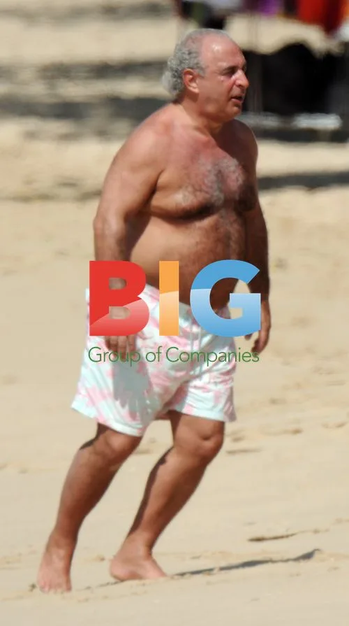 Philip Green Spotted Shirtless on Caribbean Beach