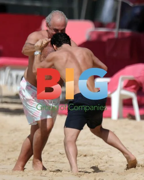 Philip Green Relaxes on Caribbean Beach
