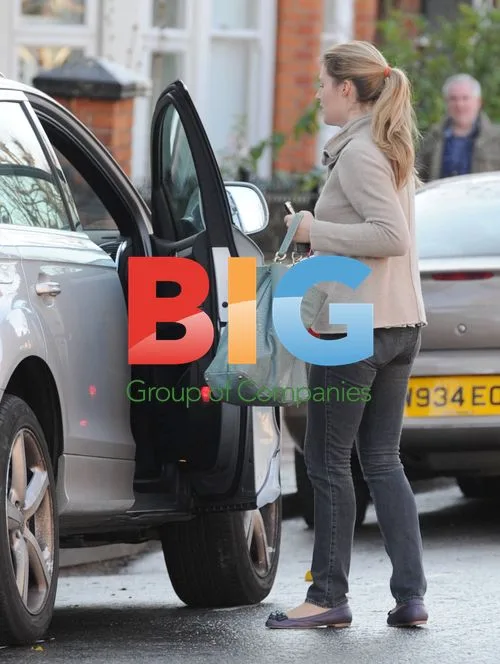 Marina Fogle with Armful of Presents