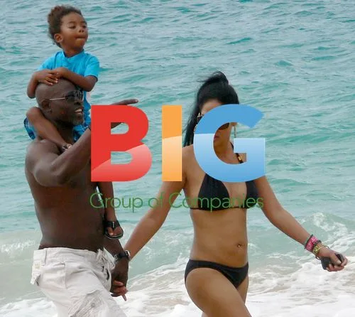 Kimora Lee, Djimon and son on beach